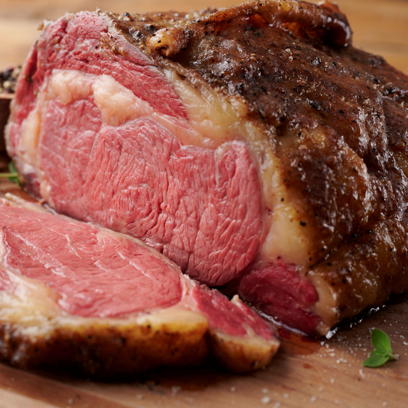 Cut piece of pre-cooked smoked prime rib with marbling and seasoning