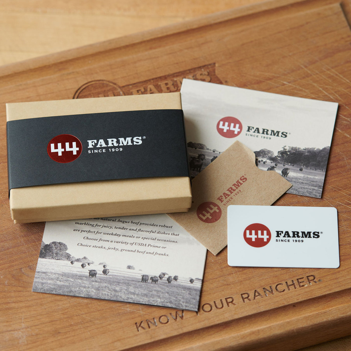 Gift cards from 44 Farms, showing a black card with the 44 Farms logo, a gift box, and a printed card with the same design.