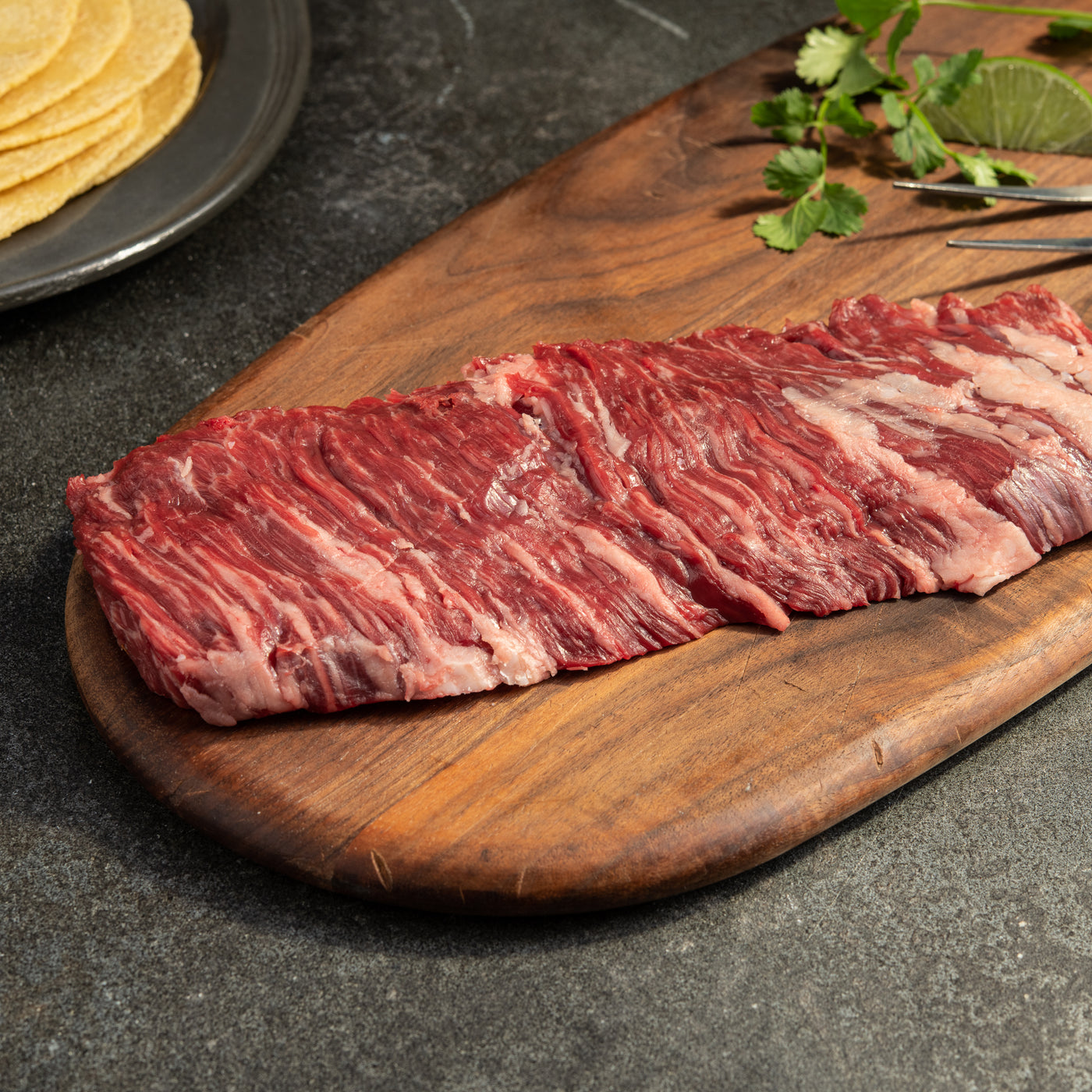 44 Farms usda choice outside skirt steak on wooden cutting board