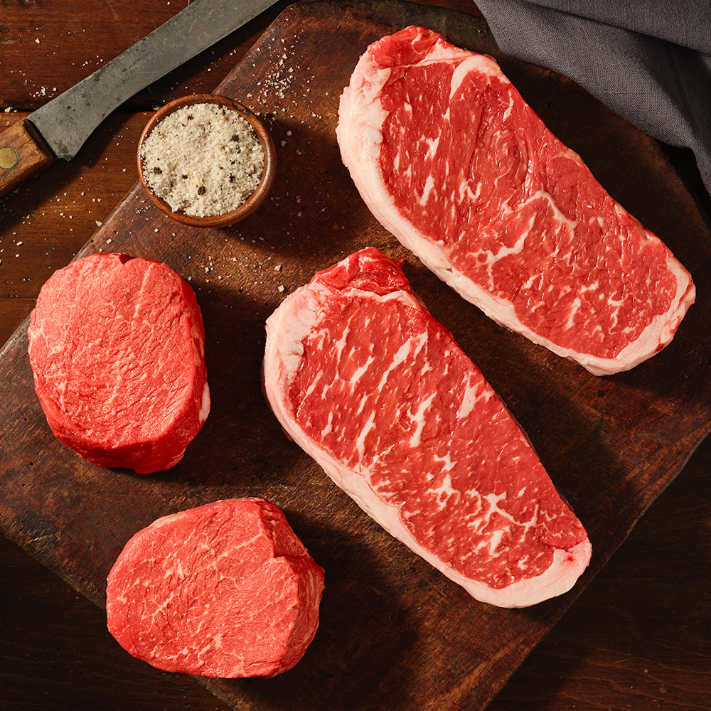USDA Prime Steak Sampler featuring Black Angus Prime New York Strip steaks, Prime Top Sirloin steaks, and Black Pepper Infused Salt from 44 Farms